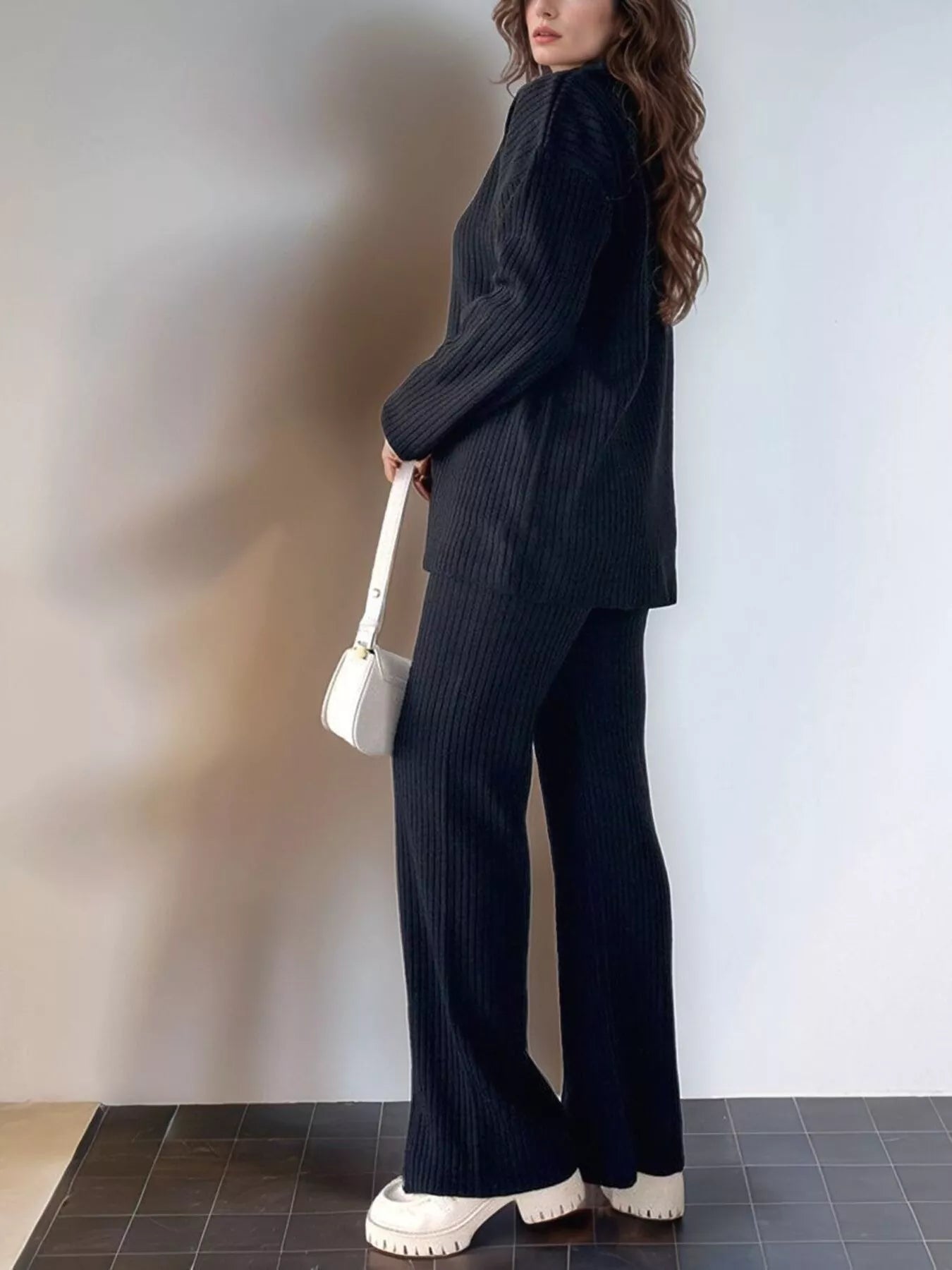 Black ribbed knit pullover top with matching pants, long sleeves, full length