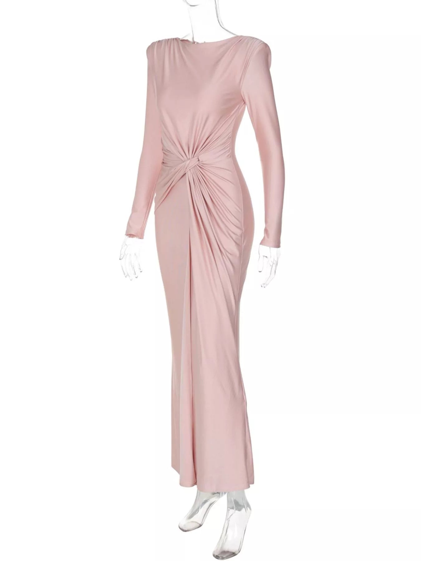 Light pink twisted long sleeve maxi dress on mannequin with gathered center knot detail