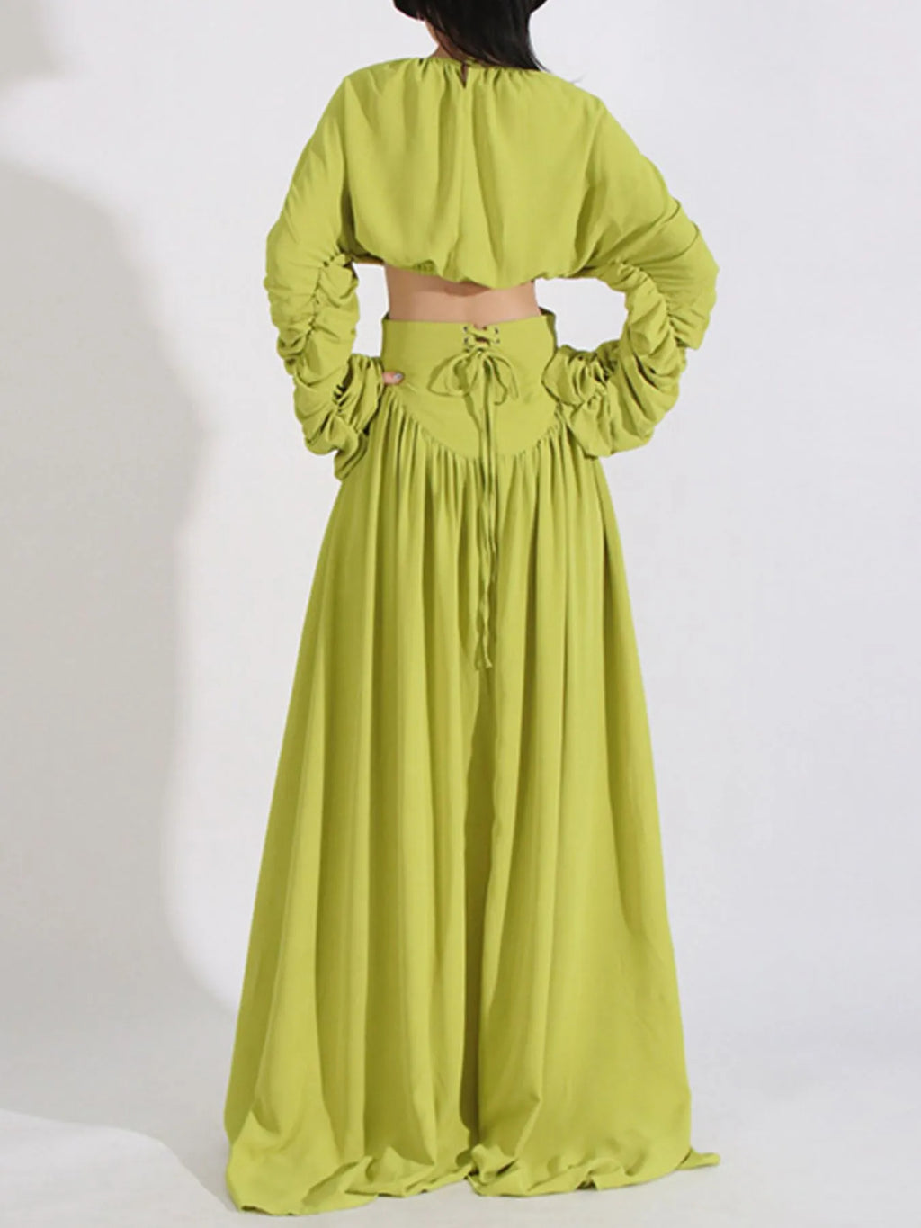 Green ruched crop top and high-waist maxi skirt with drawstring waist