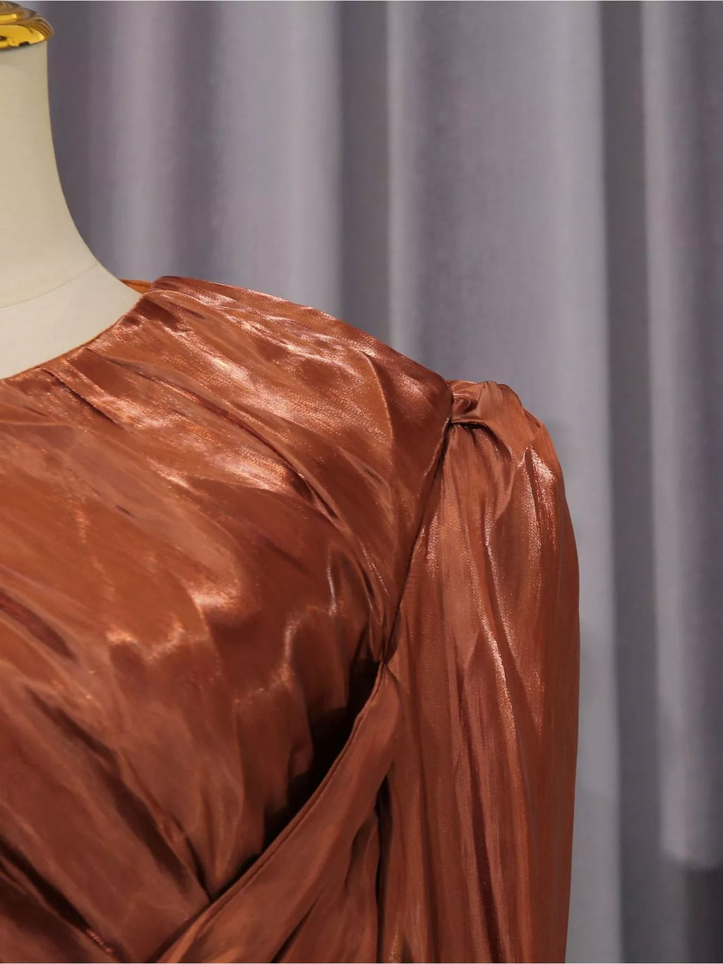 Rust satin maxi dress with twisted front drape and long sleeves