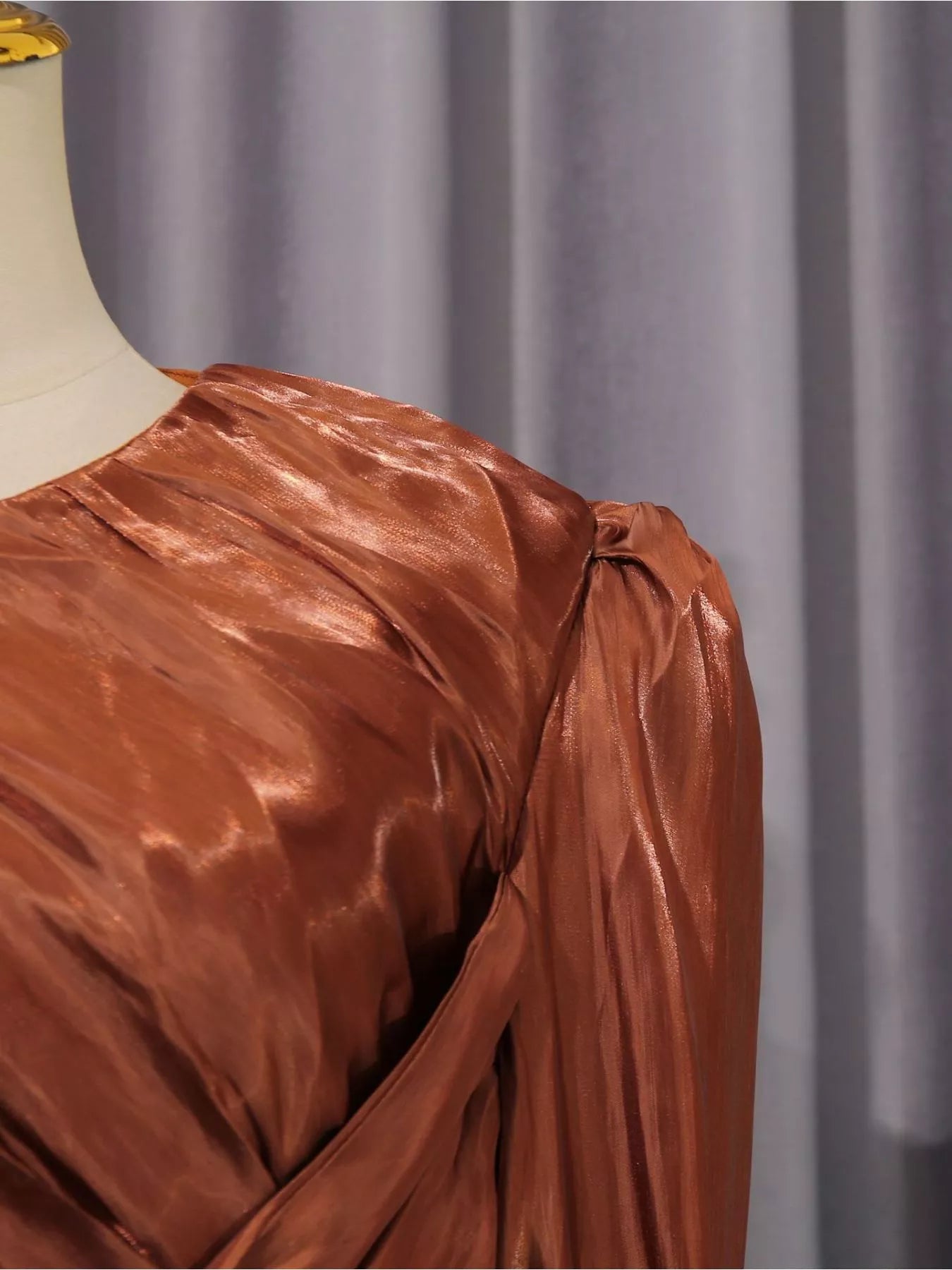 Rust satin maxi dress with twisted front drape and long sleeves