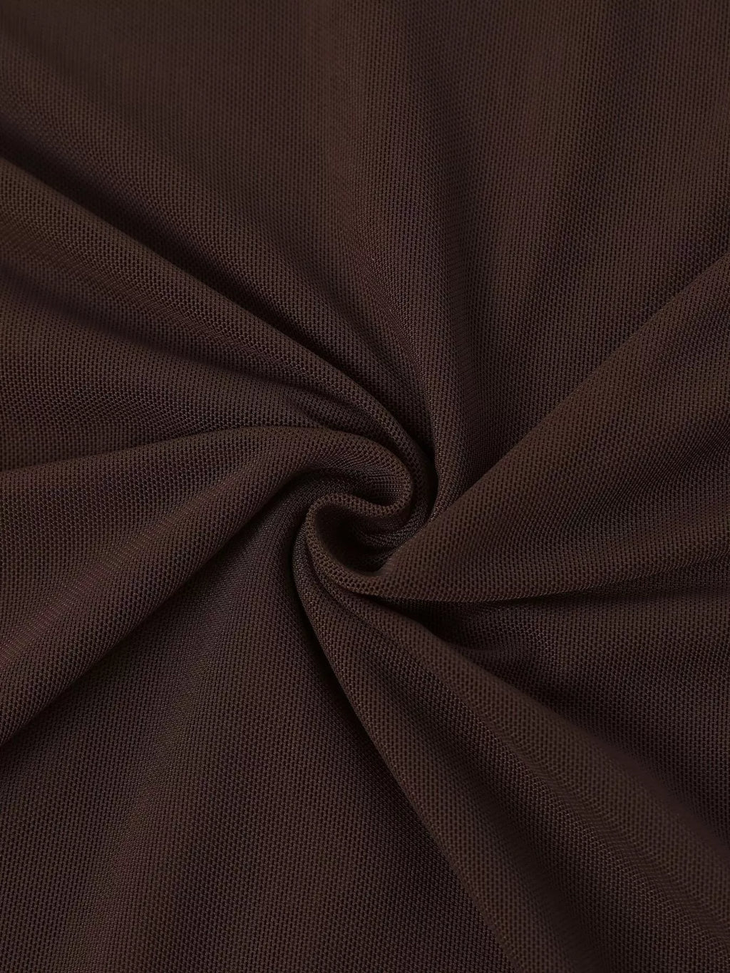 Close-up of brown fabric drape and ruching on an off-shoulder maxi dress