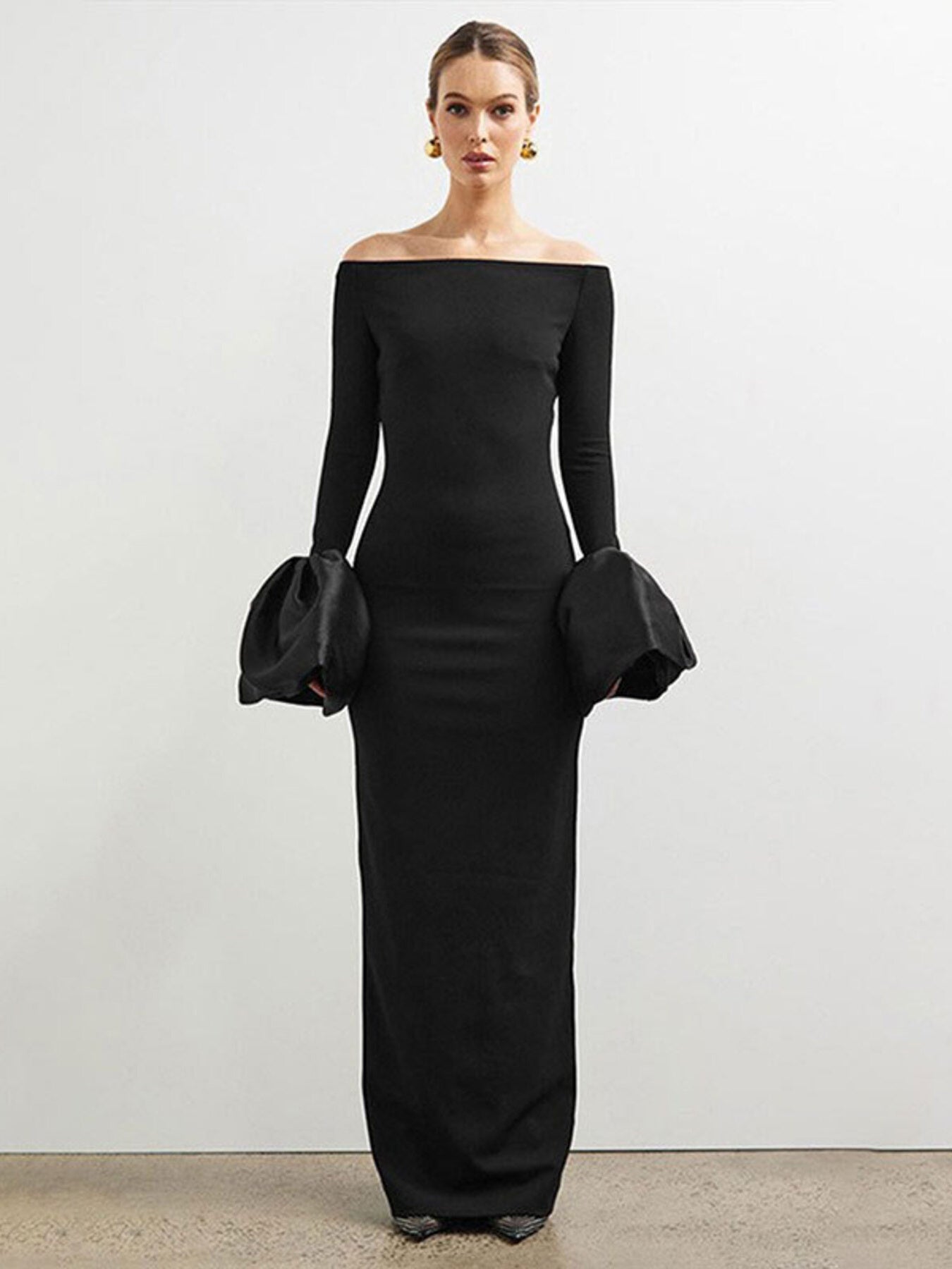 Black off-shoulder flounce maxi dress with long fitted sleeves and gathered cuffs
