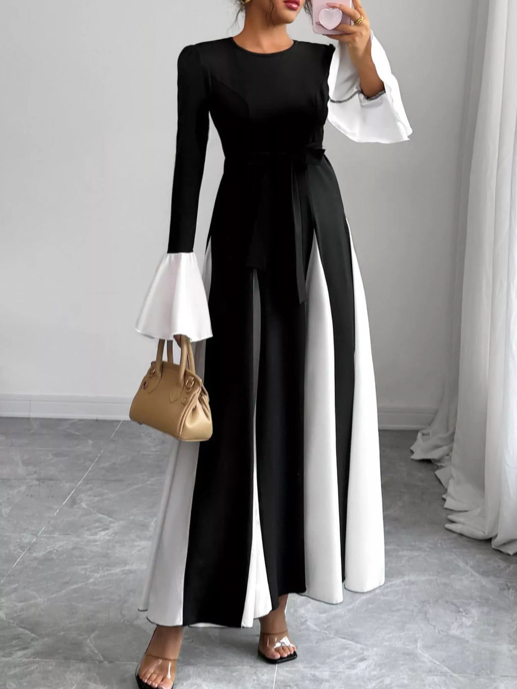 Black maxi dress with round neck and waist tie, white side panels and flared sleeve cuffs