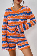 Striped knit sweater and shorts set in orange-red and blue wavy stripes, long sleeves.