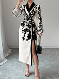 White and black floral wrap midi dress with long sleeves and front slit