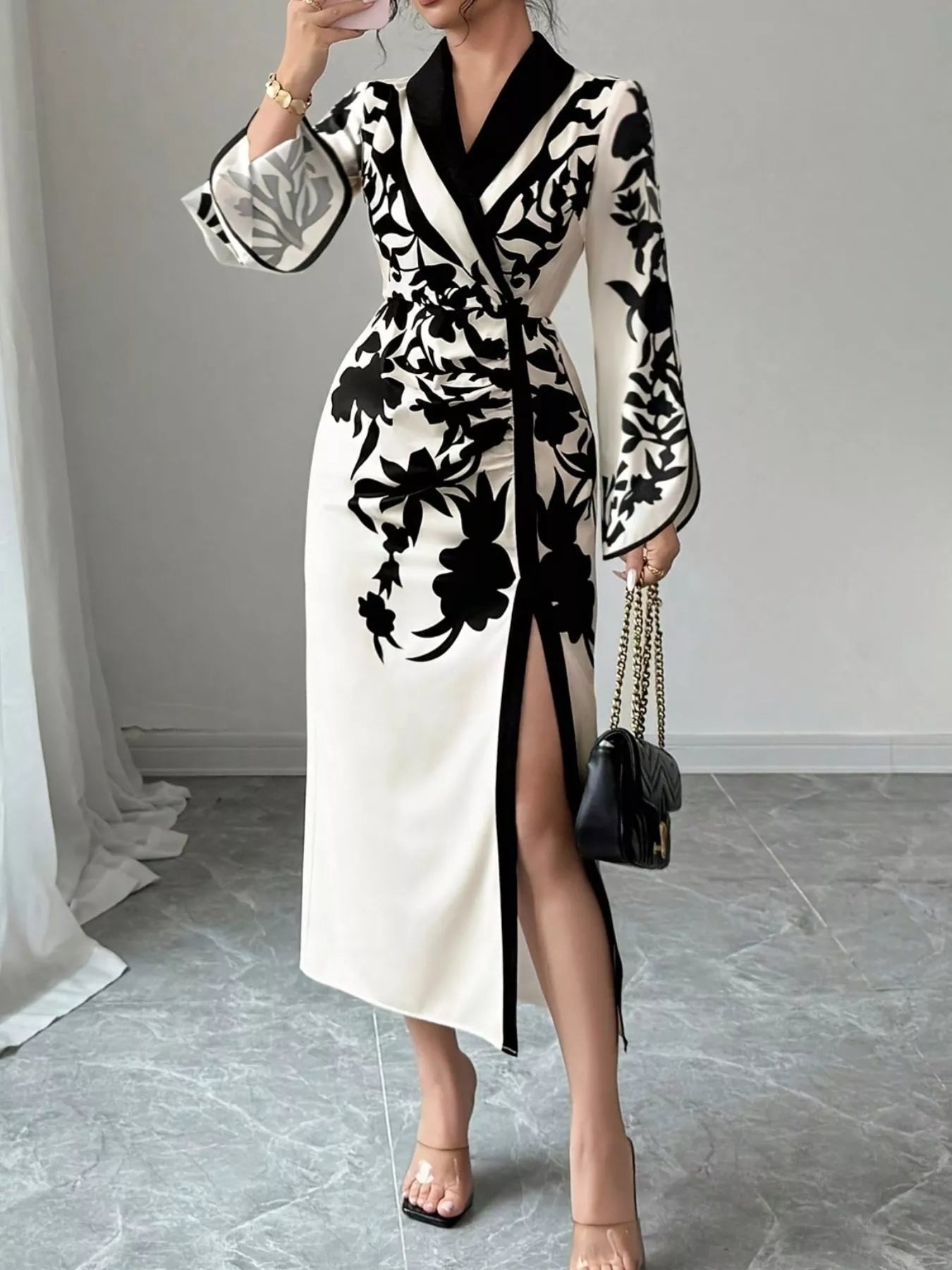 White and black floral wrap midi dress with long sleeves and front slit