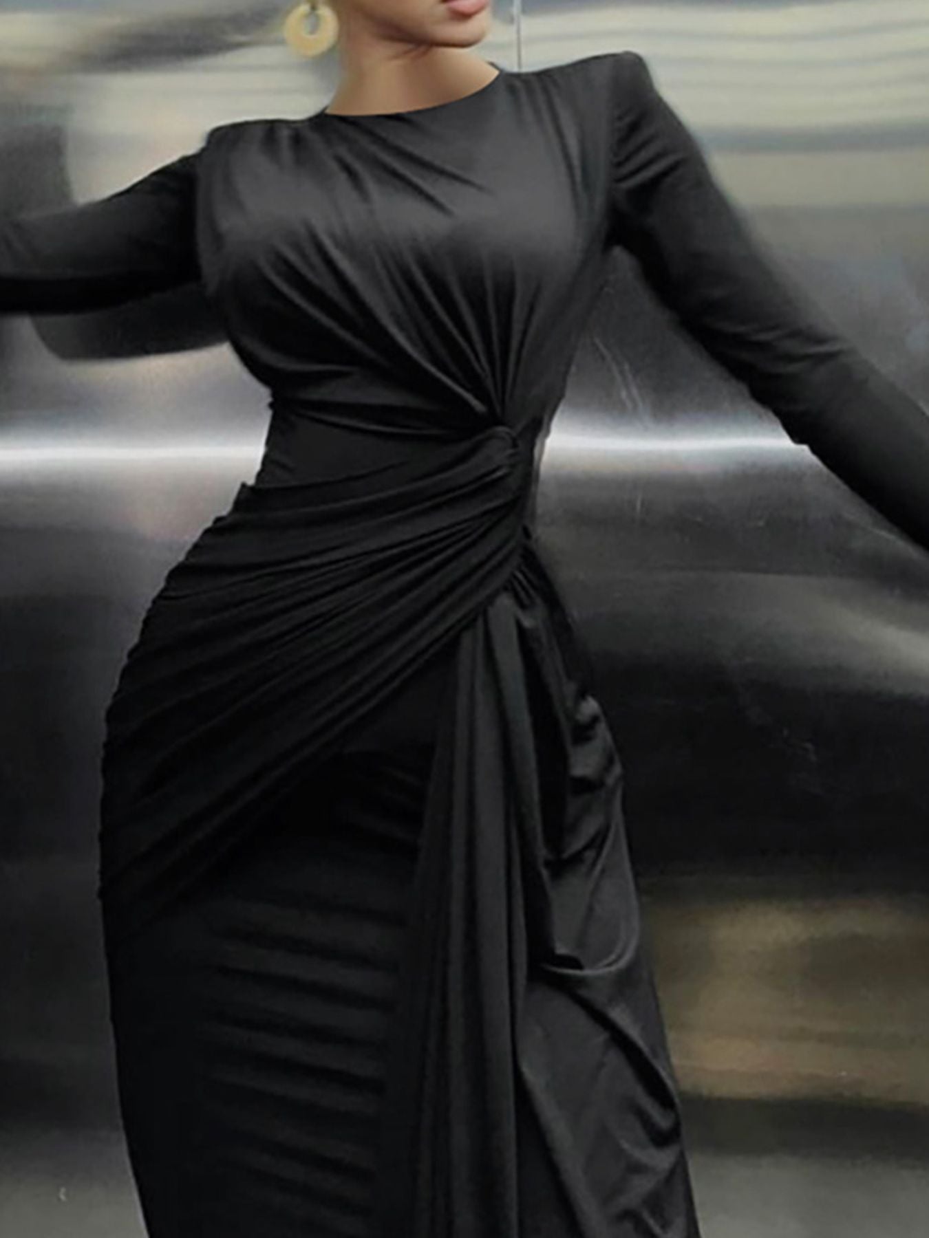 Black long-sleeve maxi dress with ruched knot front and cascading side drape