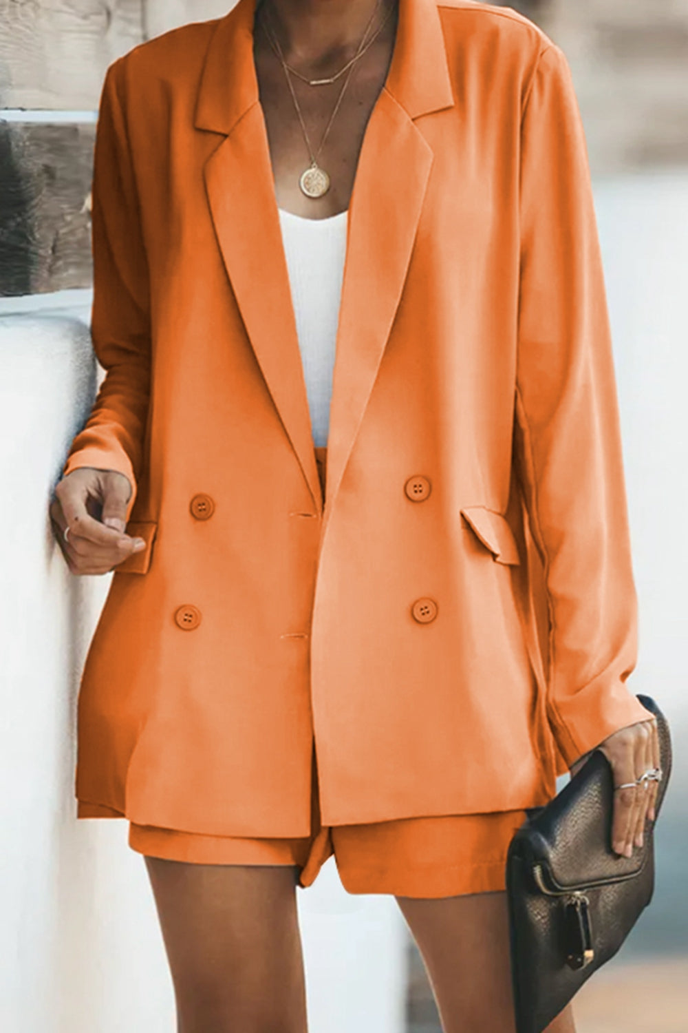 Orange longline blazer and matching shorts set with button front and pockets