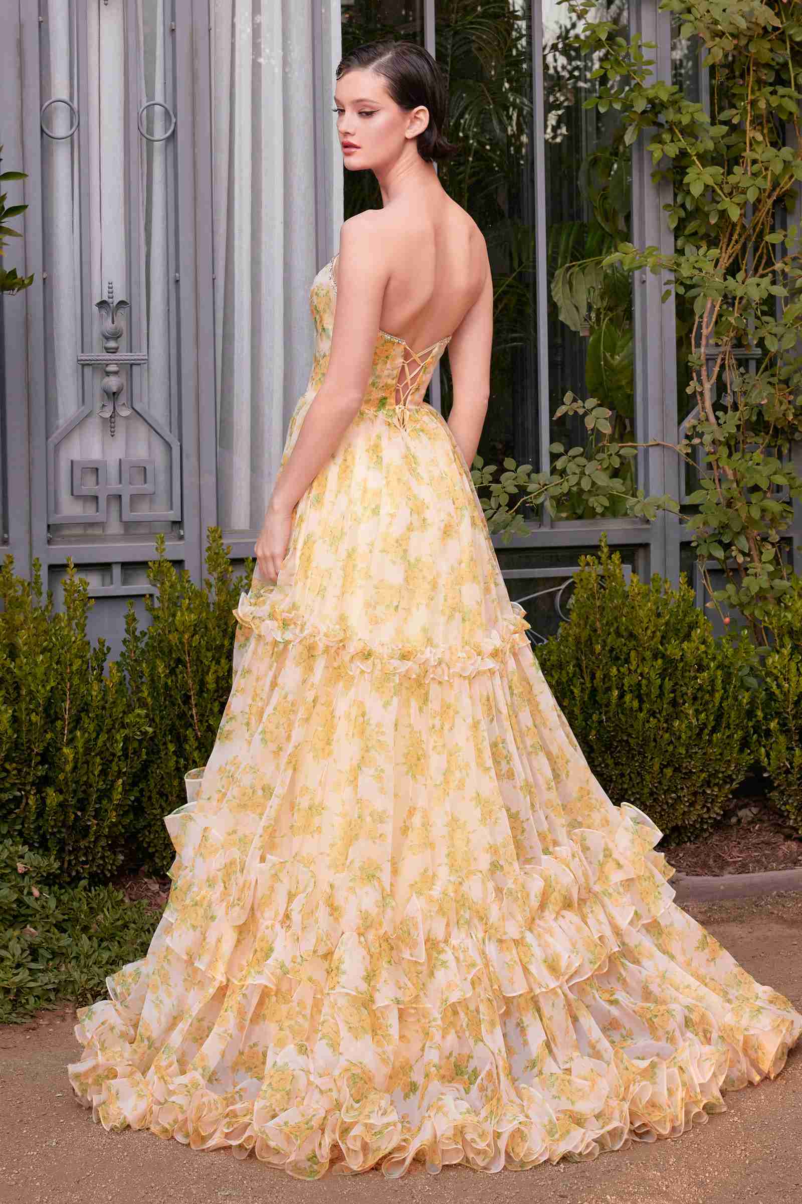 Yellow strapless floral ball gown with tiered ruffle skirt, open back