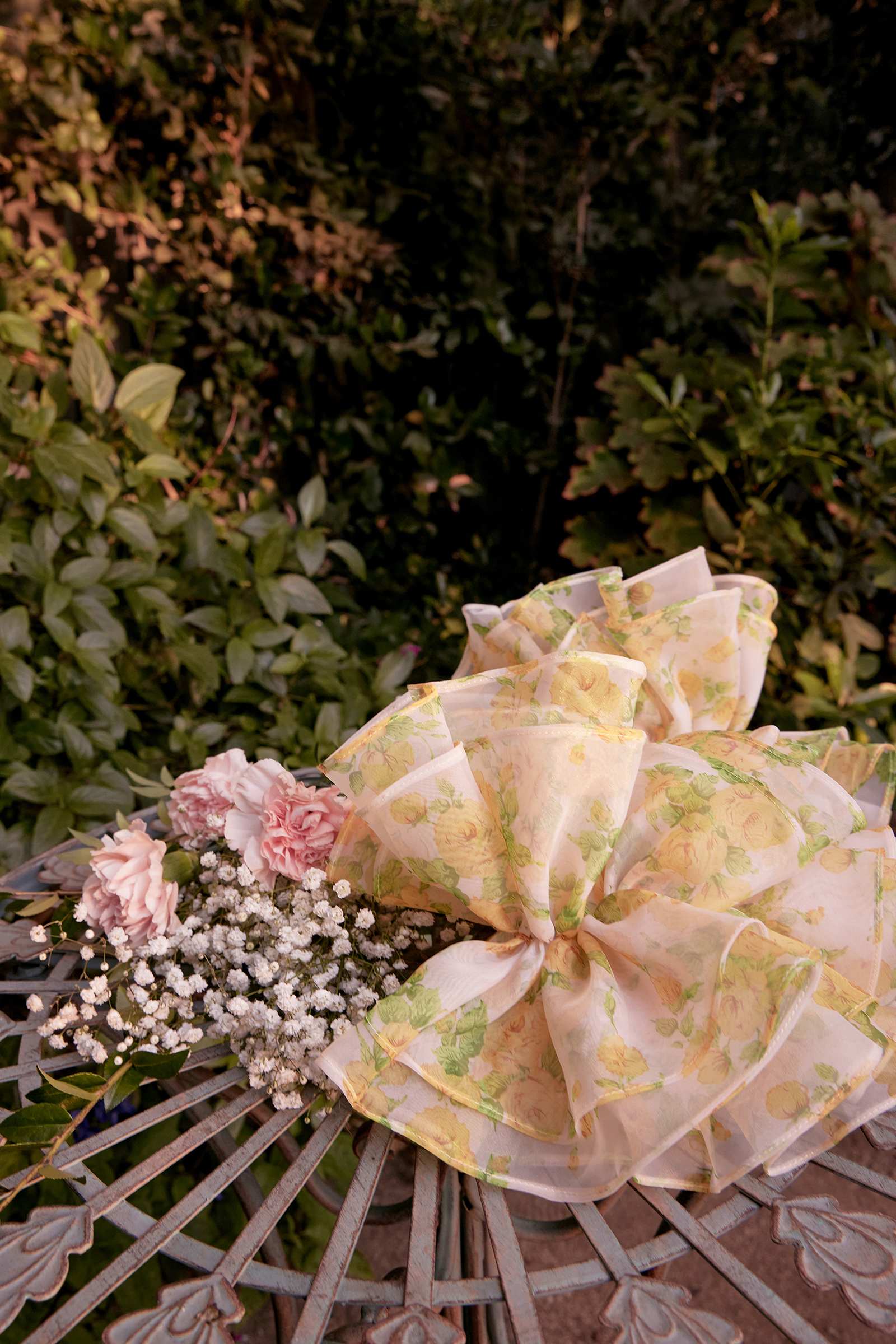 Yellow floral ball gown detail with sheer ruffles and large ribbon bow