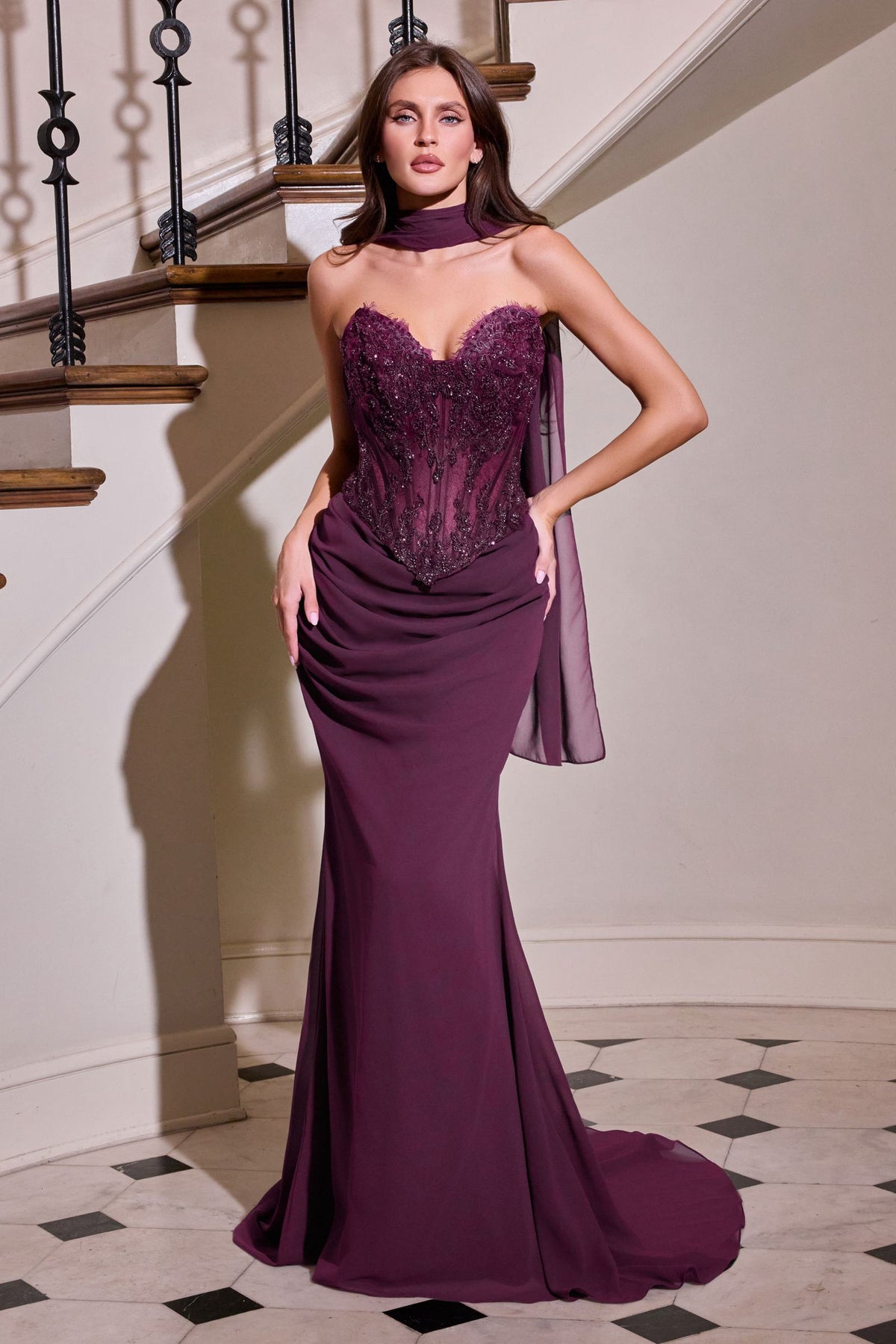 Eggplant strapless fitted gown with glittering corset bodice and draped waist