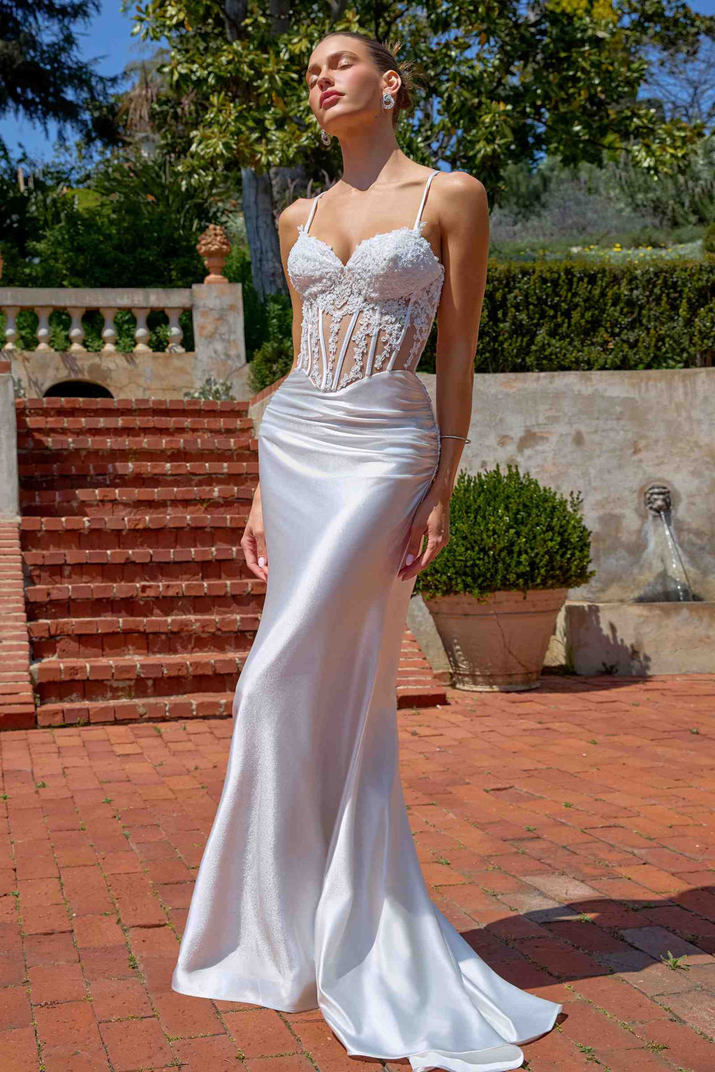 Off-white fitted mermaid gown with sheer corset bodice, lace detail, thin spaghetti straps