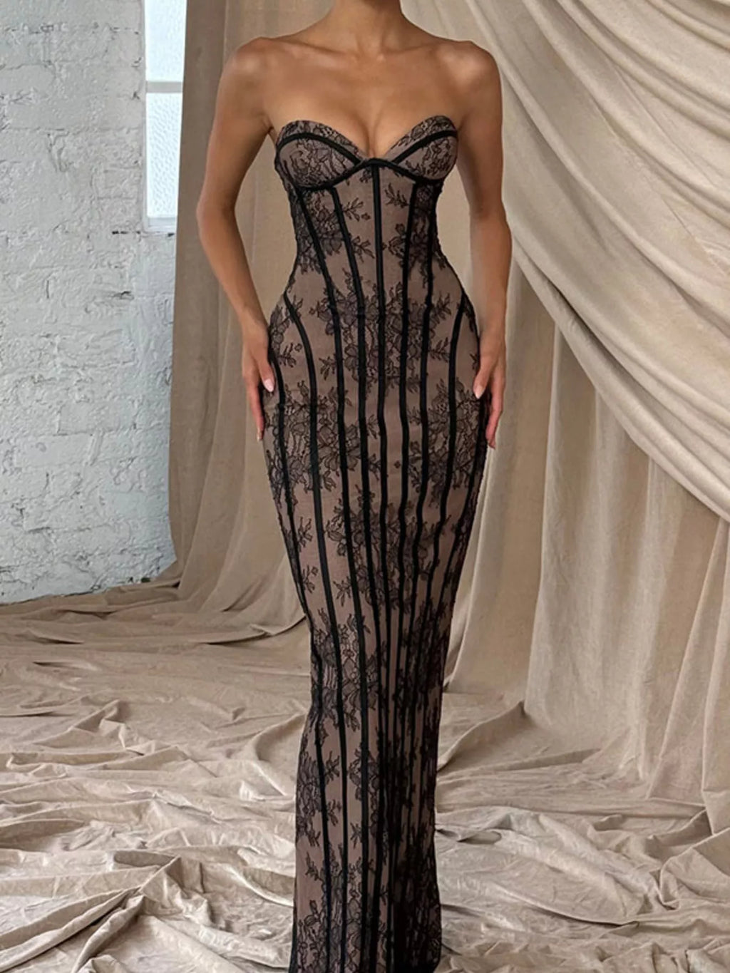 Strapless dark lace maxi dress with sweetheart neckline, fitted column silhouette