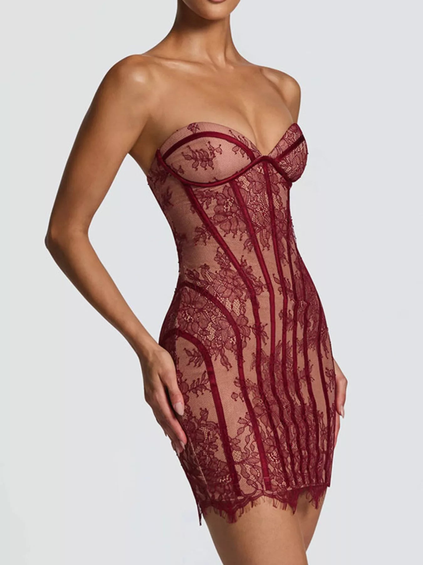 Burgundy lace detail tube mini dress, angled front with lace bow at center bust