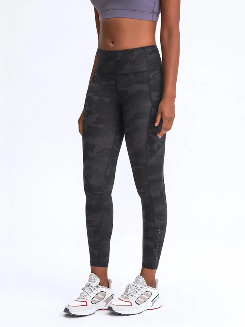 Black camo leggings with wide waistband and side pockets, cropped front view
