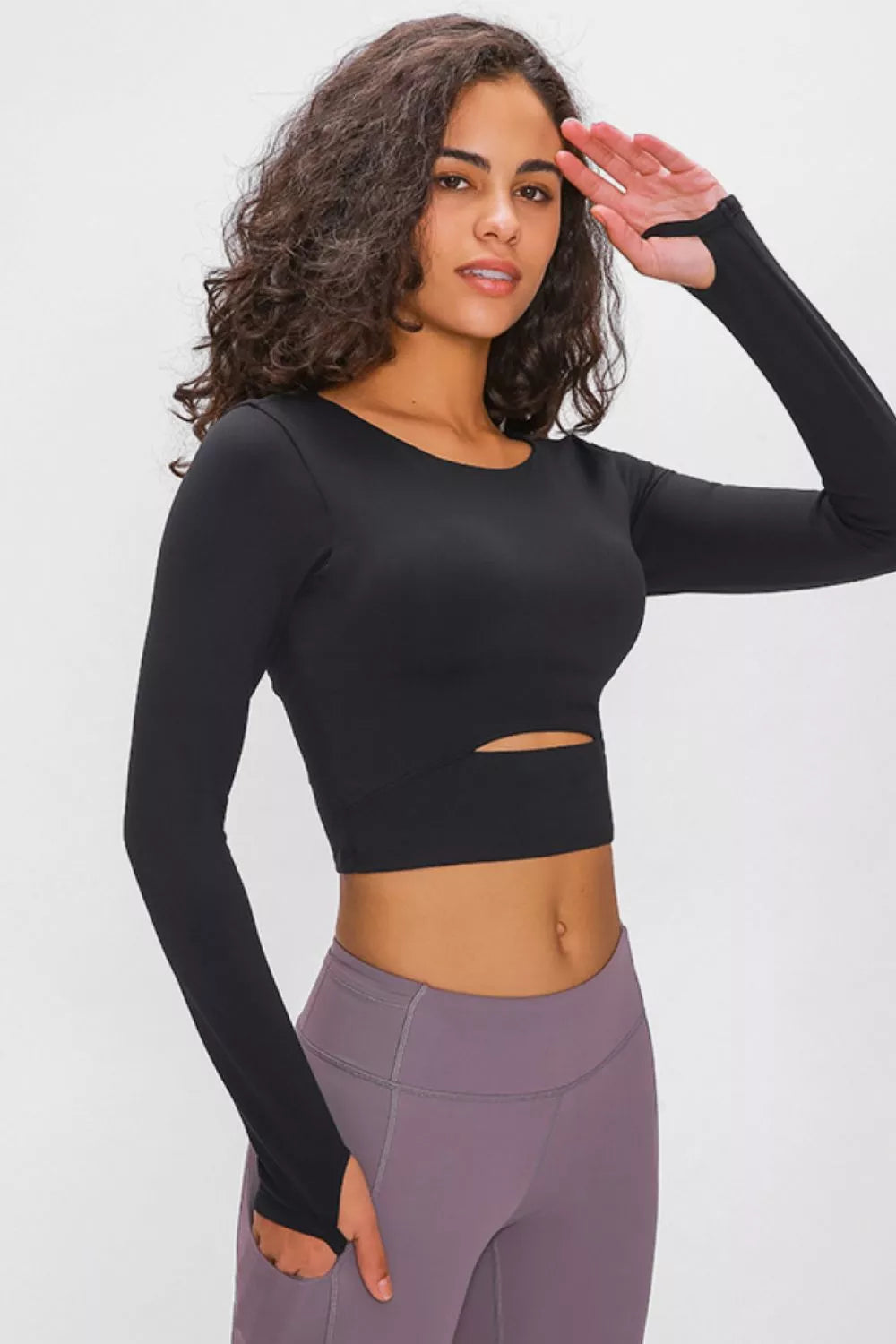 Black long-sleeve cropped sports top with chest cutout and crew neck