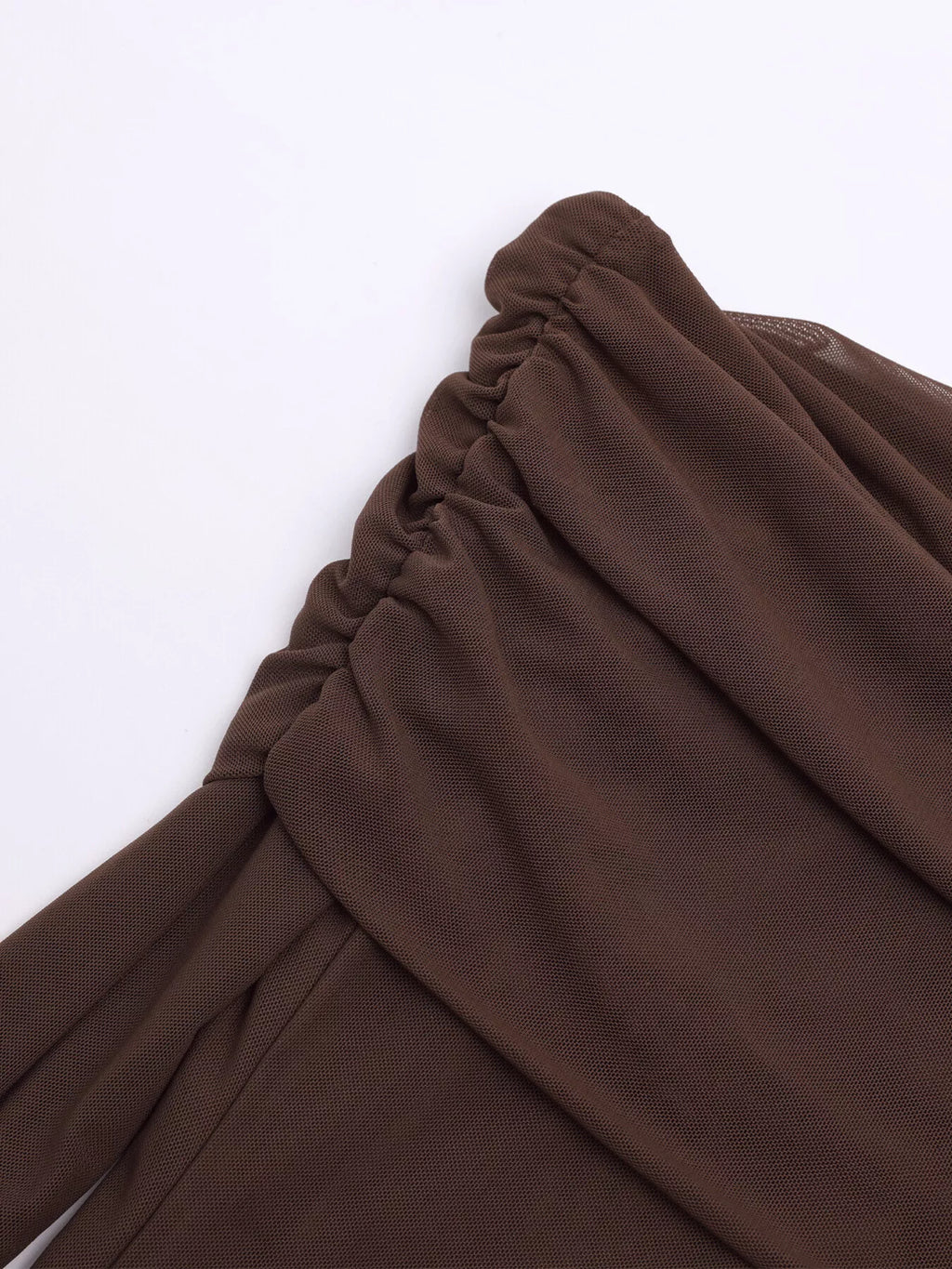 Brown ruched fabric fold detail at the off-shoulder neckline