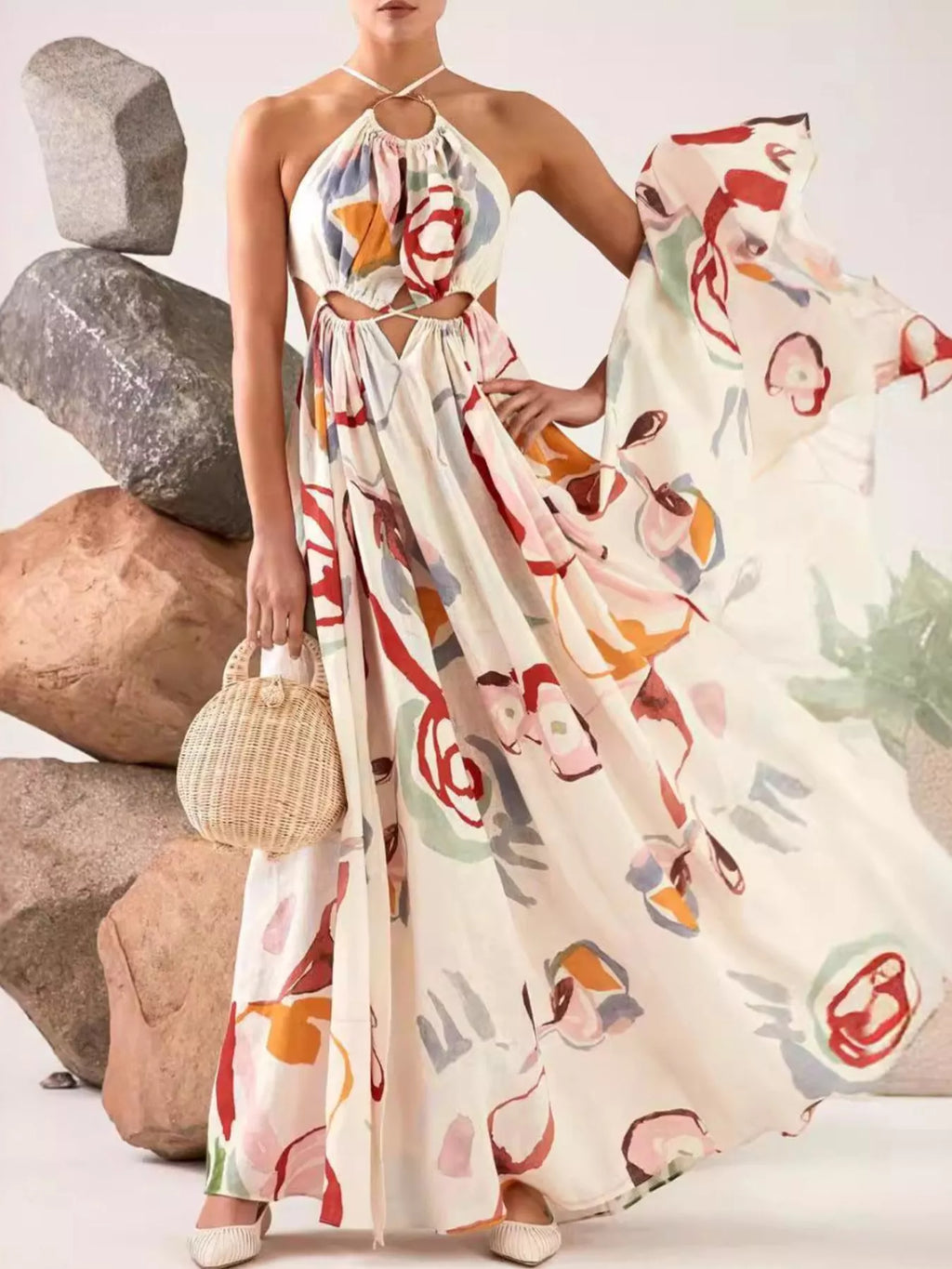 Printed halter-neck cut-out maxi dress, white base with colorful abstract print, full-length skirt