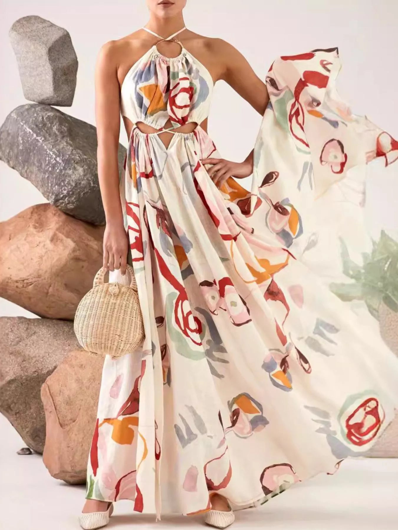 Printed halter-neck cut-out maxi dress, white base with colorful abstract print, full-length skirt