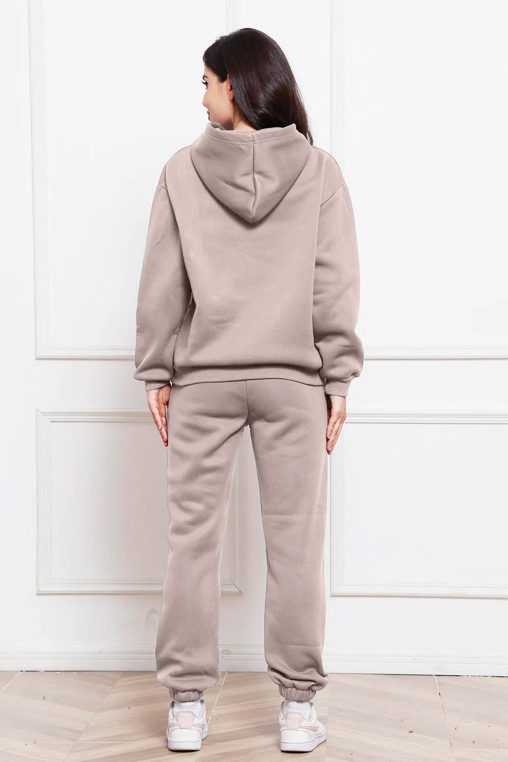 Taupe hoodie and jogger pants set with pullover hood, rear view