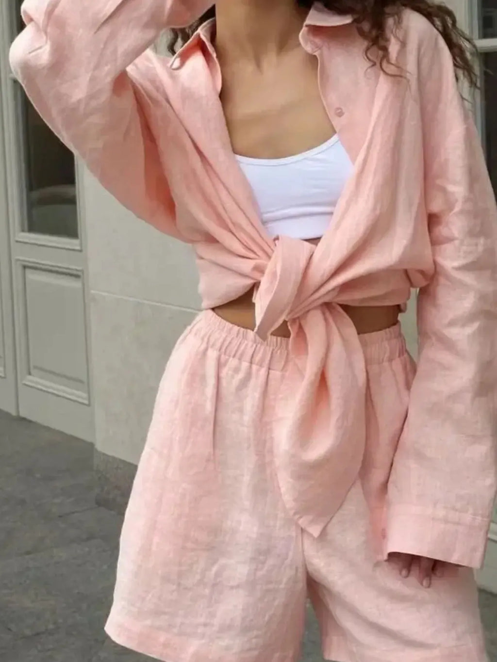 Light pink tied button-up long-sleeve shirt with matching high-waist shorts set