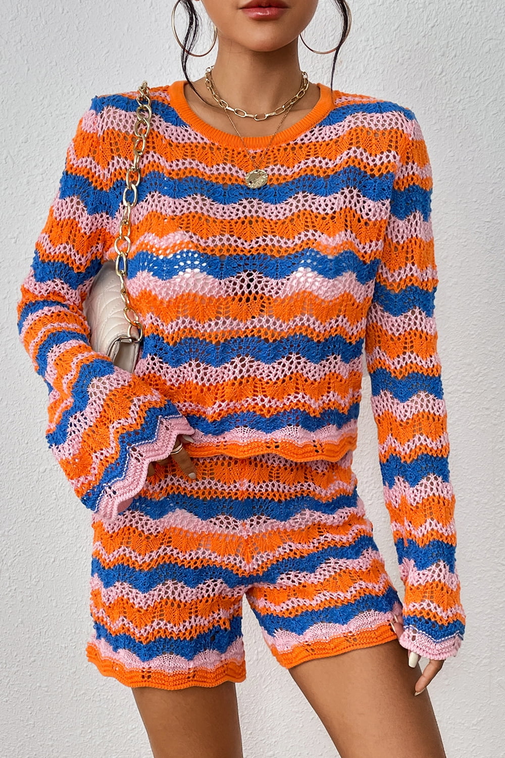 Striped knit sweater and shorts set in orange-red and blue wavy stripes, elastic waist hem.