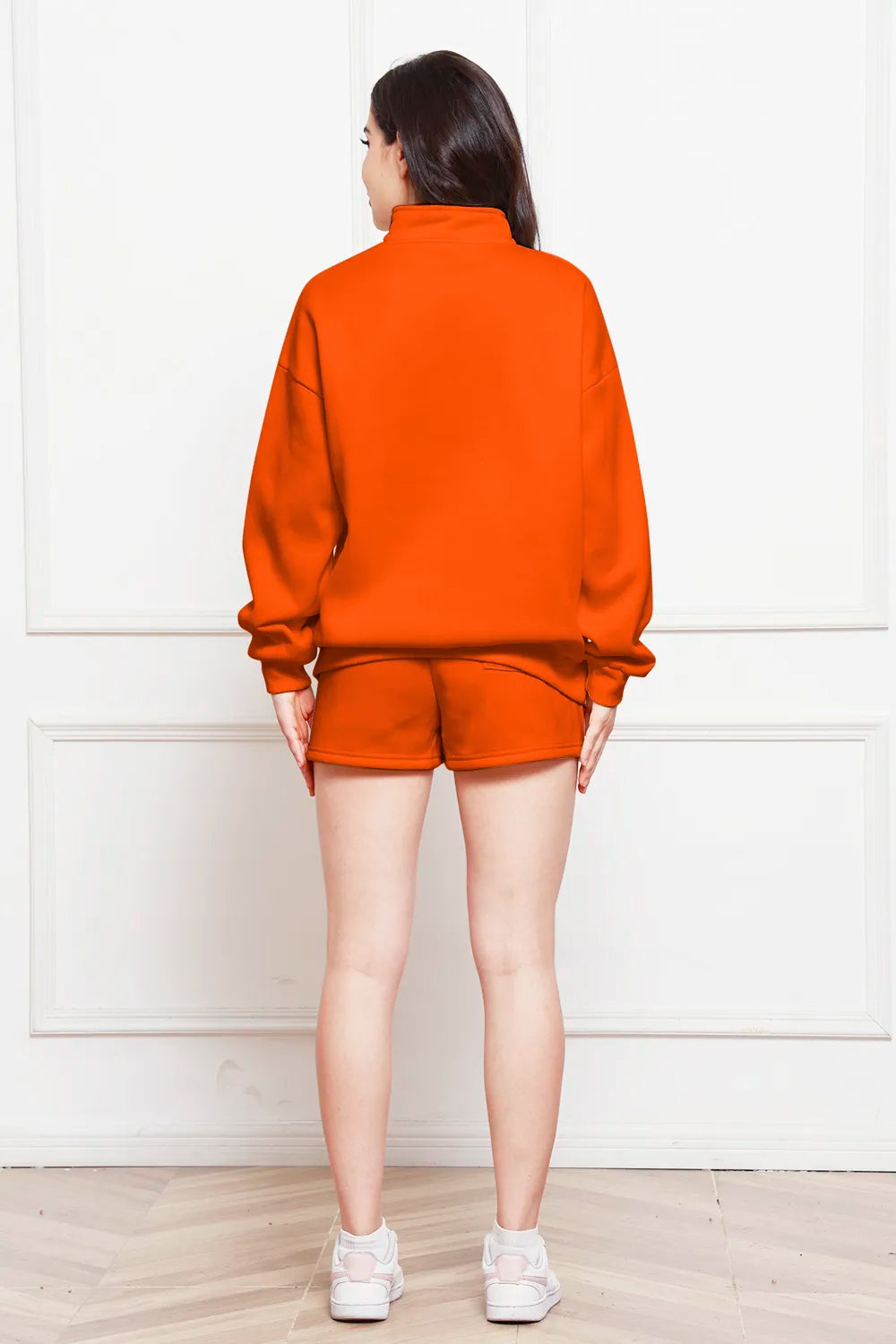 Orange half-zip long sleeve sweatshirt and drawstring shorts set, back view