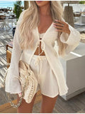 White tie-front cover-up and matching shorts set, lace-up neckline and tassel ties
