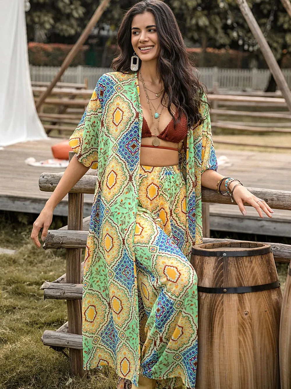 Printed half-sleeve top and wide-leg pants set, front view with multicolor motif