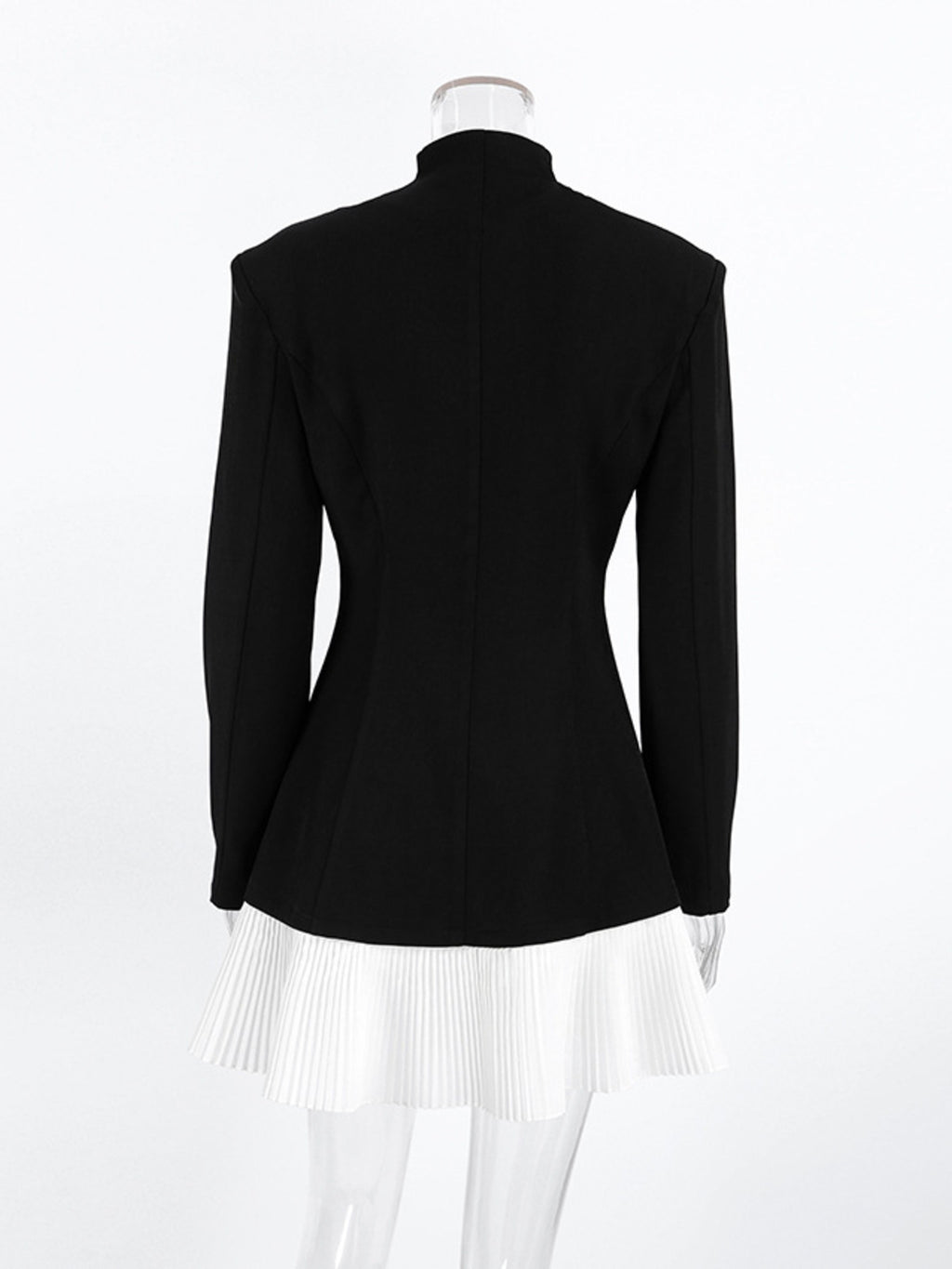 Black one-button blazer dress, back view, with long sleeves and pleated white hem