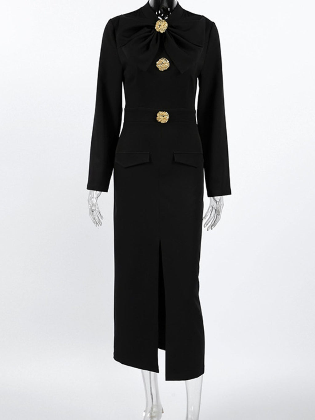 Black long-sleeve midi dress on mannequin with ruched bodice, gold buttons, and slit.