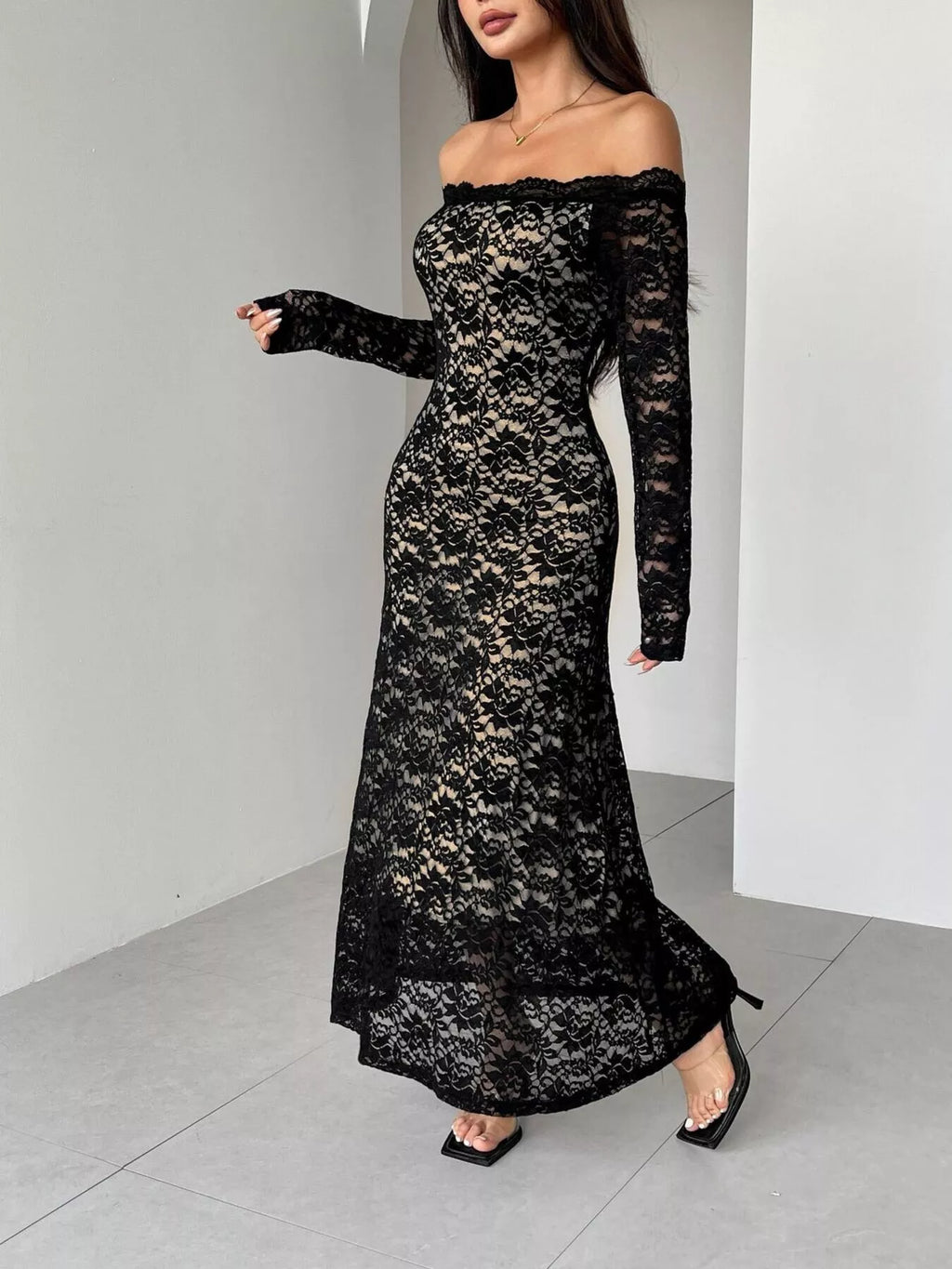 Black lace off-shoulder maxi dress with long sleeves, slim fit, and flared hem