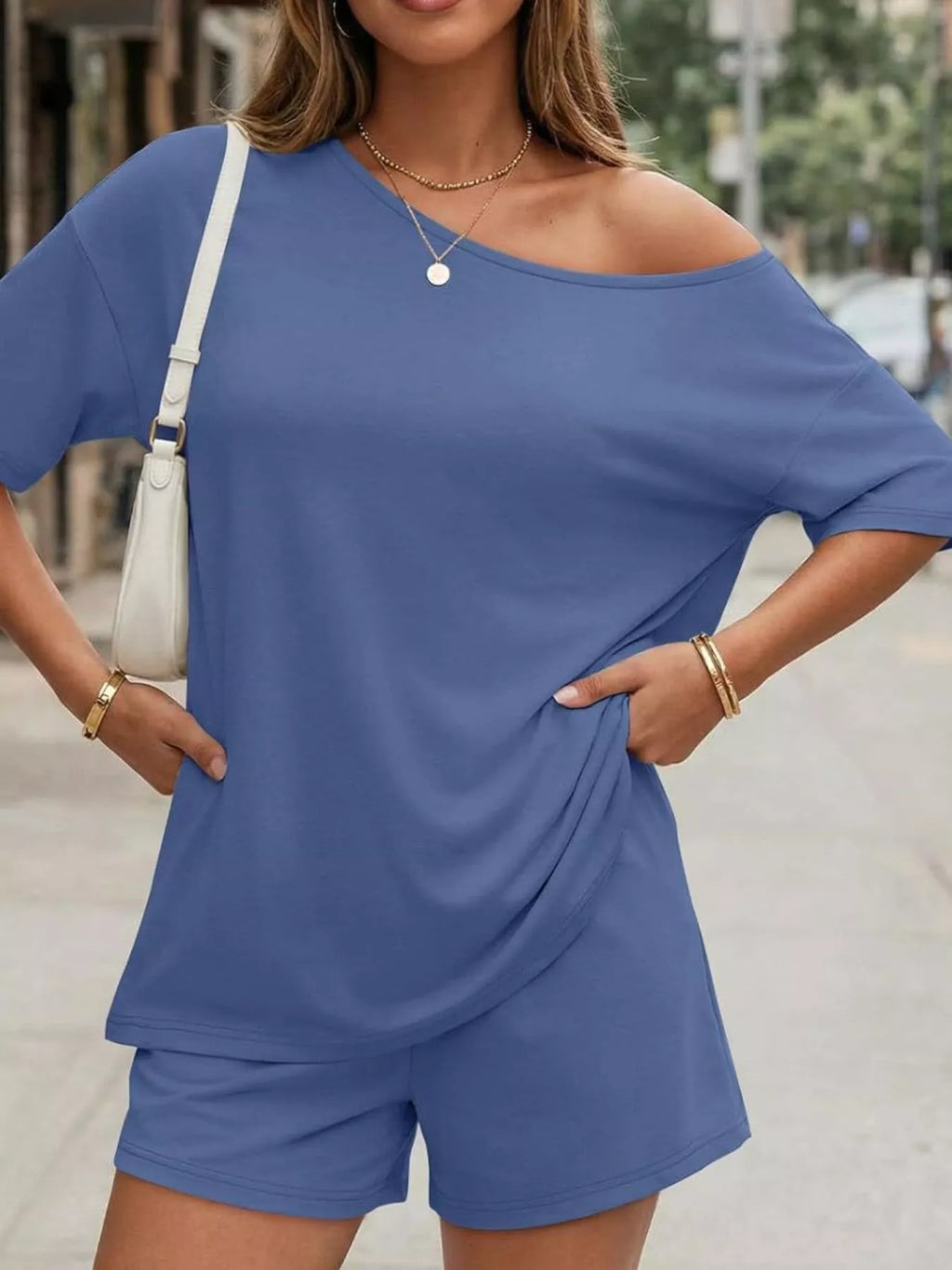 Plus size one-shoulder blue top and shorts set with diagonal neckline and relaxed drape
