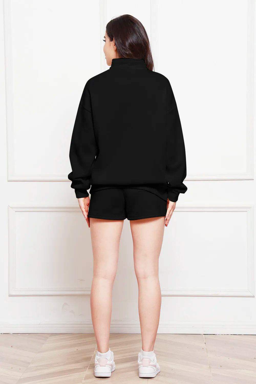 Black half-zip long sleeve sweatshirt and drawstring shorts set, back view