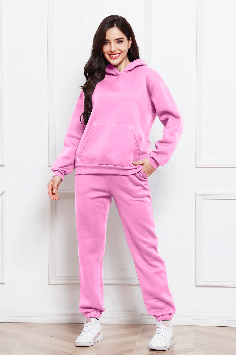 Hoodie and pants set in dusty pink with kangaroo pocket, drawstring hood, and joggers