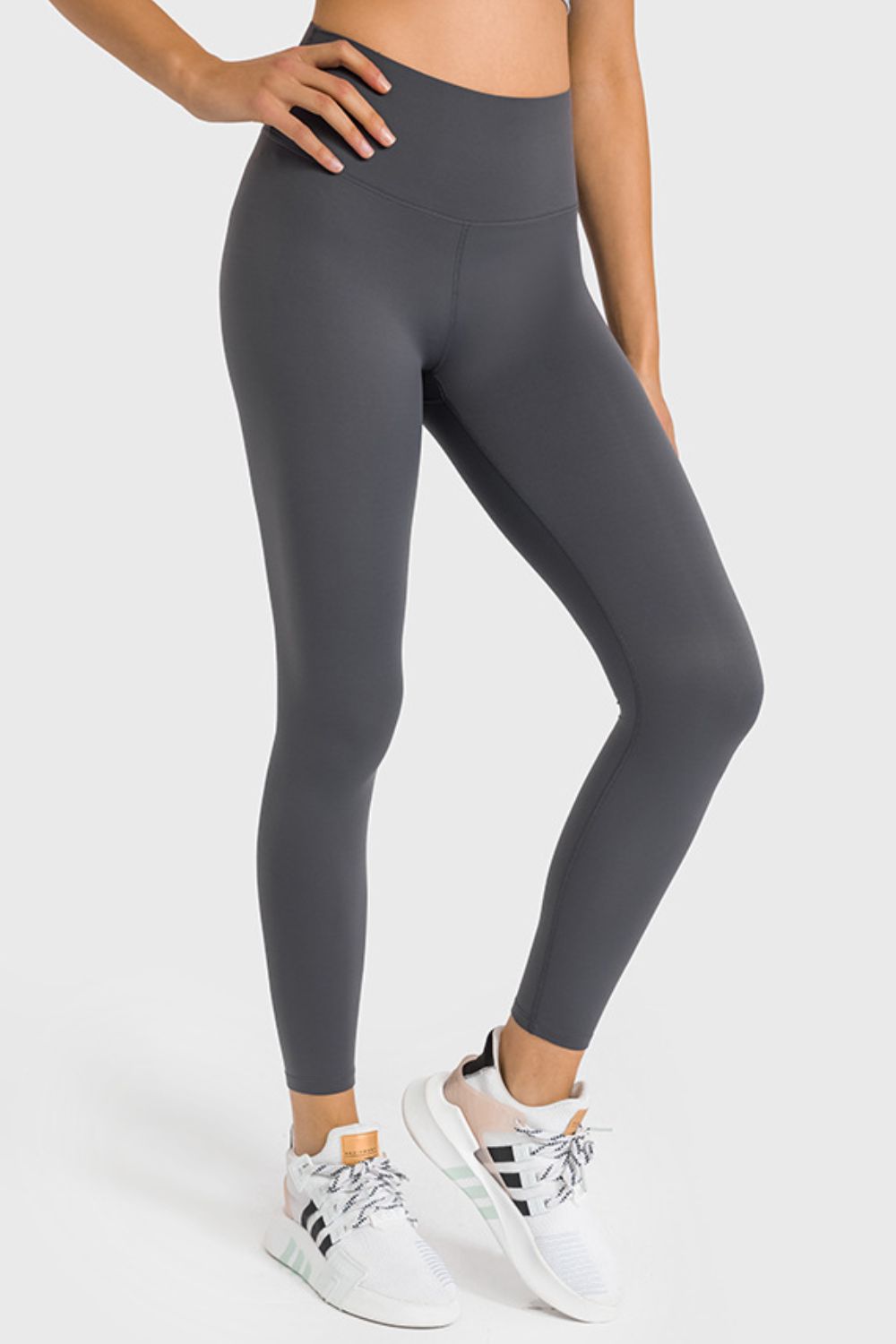 High waist ankle-length yoga leggings in dark gray, smooth fabric with contour seams