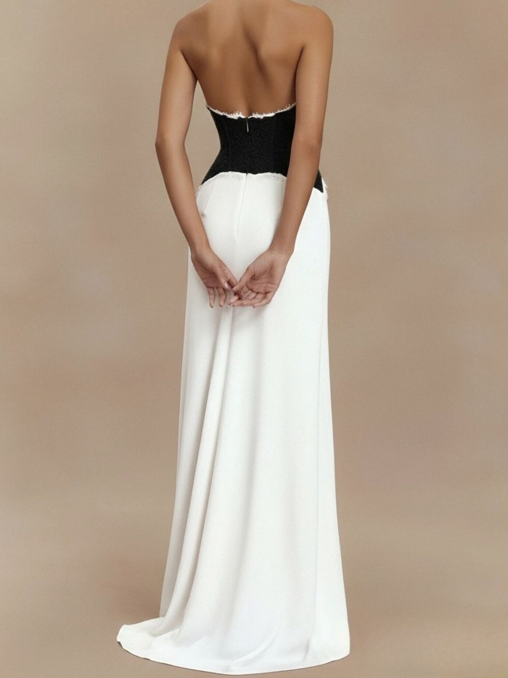 White halter maxi dress with black lace bodice and lace-trimmed waist, floor-length skirt