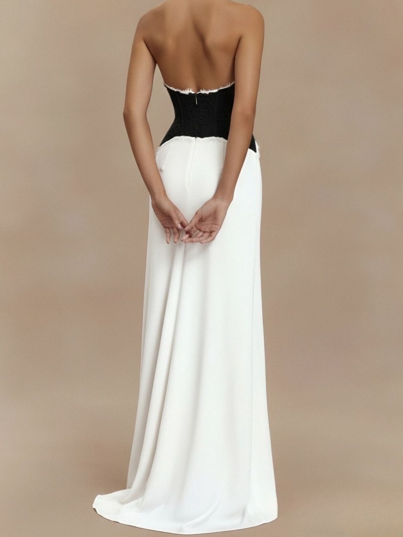 White halter maxi dress with black lace bodice and lace-trimmed waist, floor-length skirt