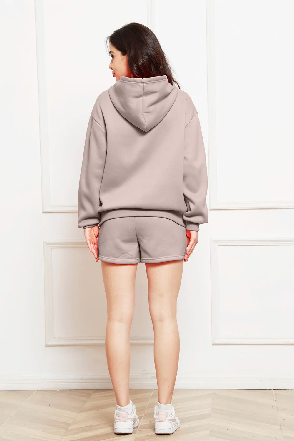 Light taupe drop-shoulder hoodie and shorts set, back view with adjustable hood.