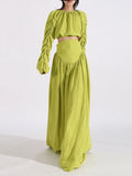 Green ruched long-sleeve crop top and high-waist maxi skirt set