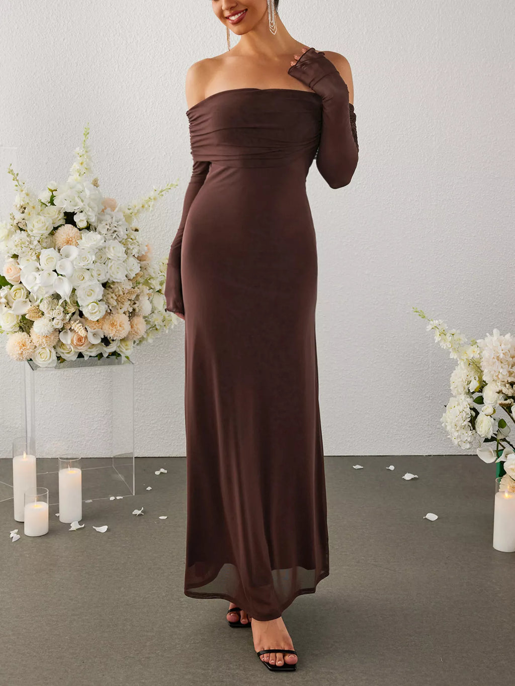 Brown off-shoulder ruched maxi dress with long sleeves, angled pose