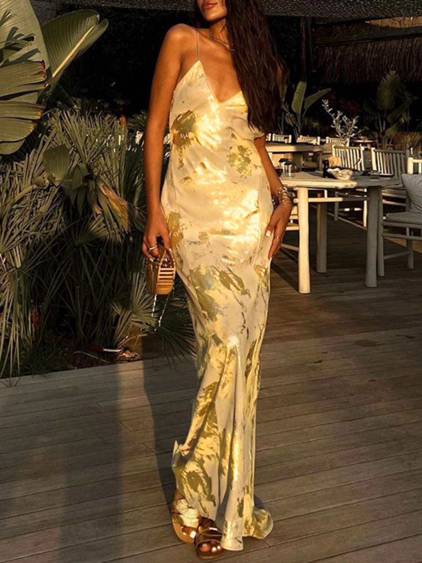 Gold backless V-neck maxi dress with thin spaghetti straps, shimmering gold print