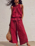 Scarlet smocked ruffled hem top and wide-leg pants set, sleeveless and tiered hem.