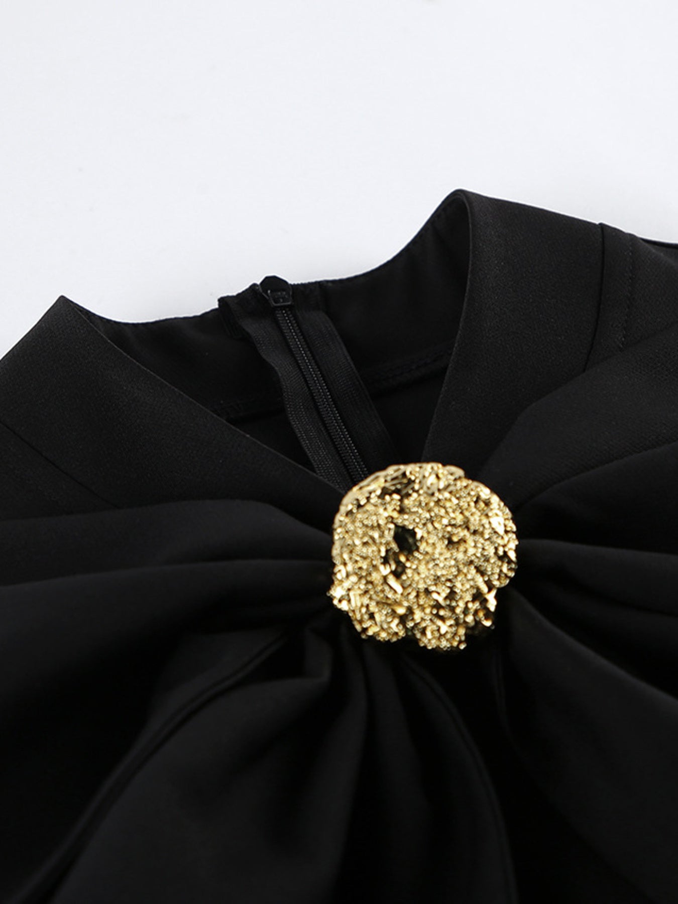 Black ruched midi dress with large gold button at neckline and zip
