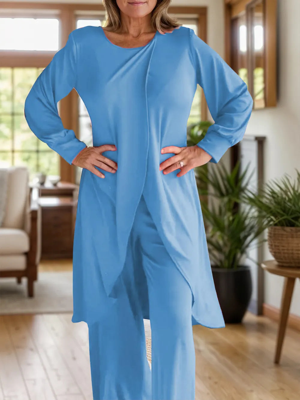 Two-piece slit top and pants set, light blue, long sleeves, round neck, front view.