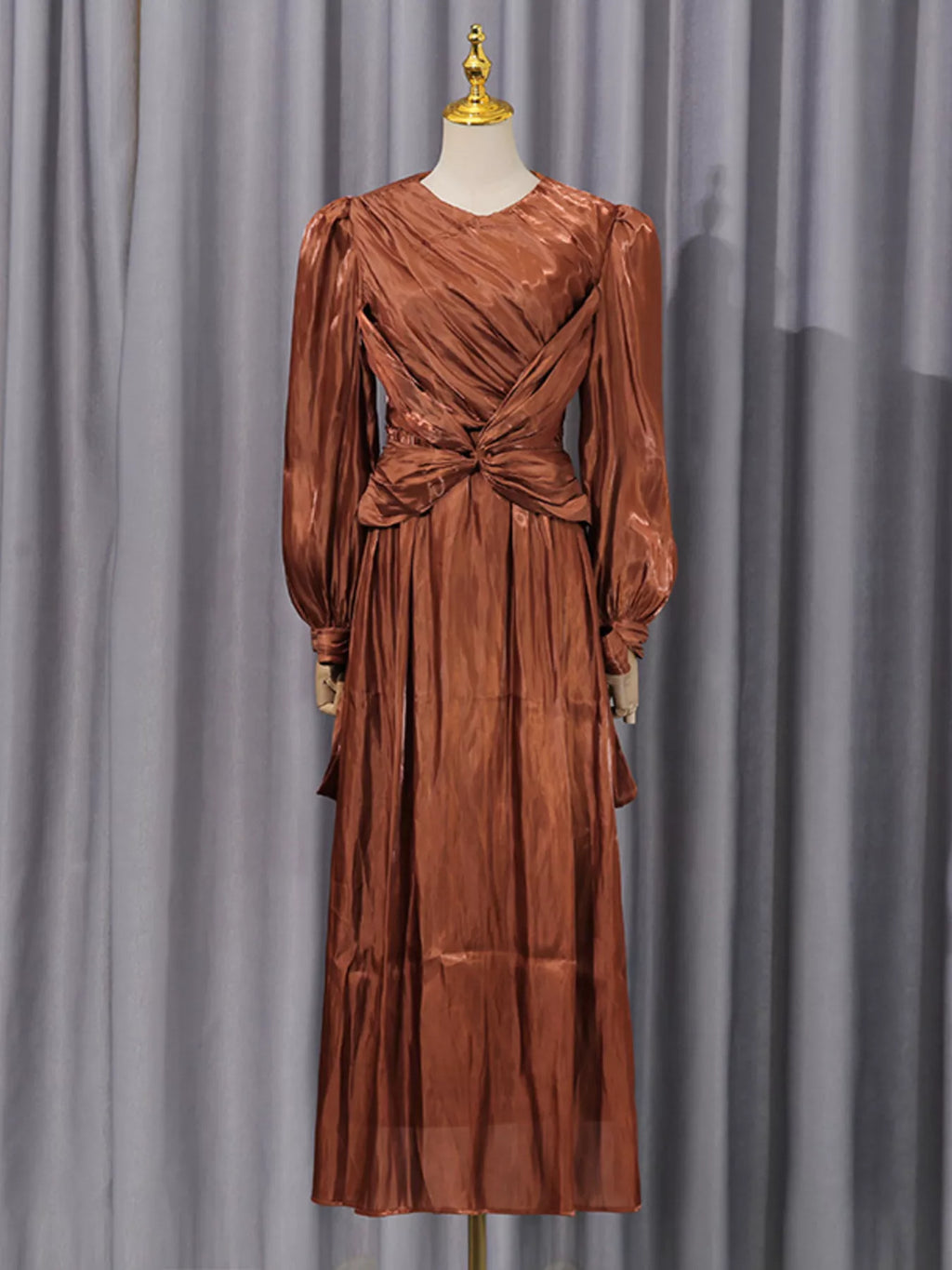 Coffee-brown long-sleeve draped maxi dress with center-twist bodice