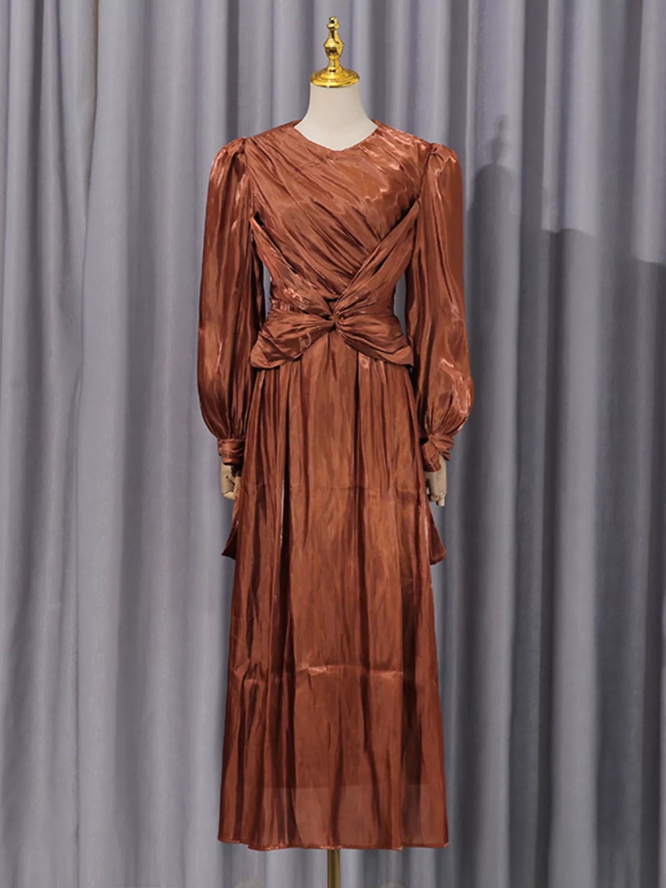 Coffee-brown long-sleeve draped maxi dress with center-twist bodice