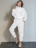 White quarter-zip sweatshirt and jogger pants set with drawstring waist and cuffs