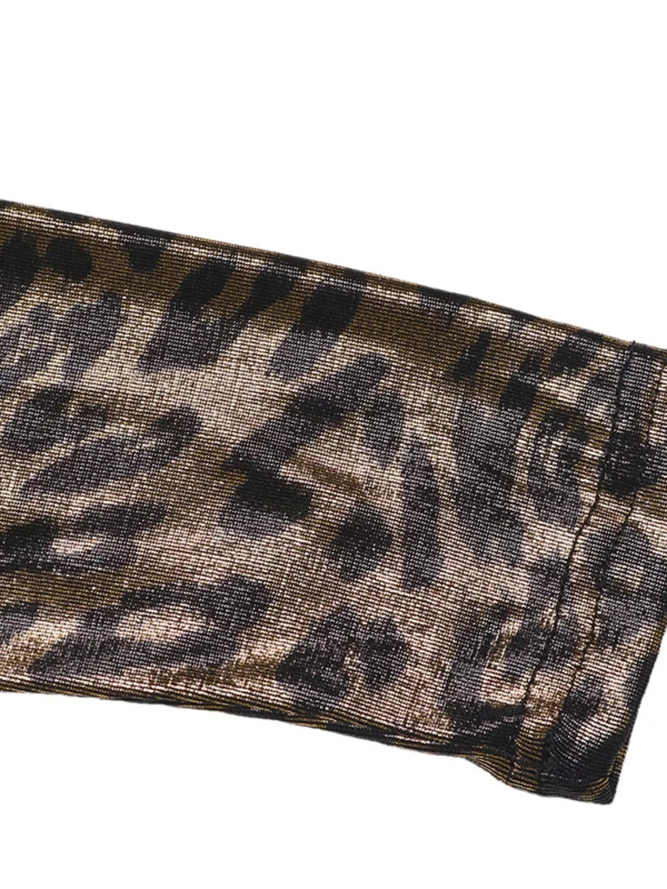 Metallic leopard-print sleeve cuff on a black surplice dress